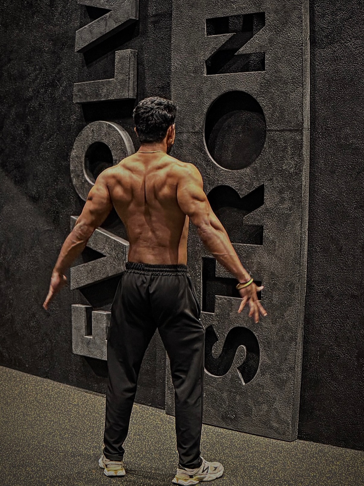 Athlete posing at the EVOLVE STRONG wall