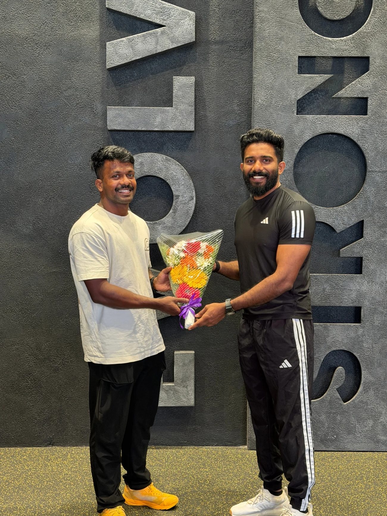 The team behind B6 Fitness 360 at the EVOLVE STRONG wall