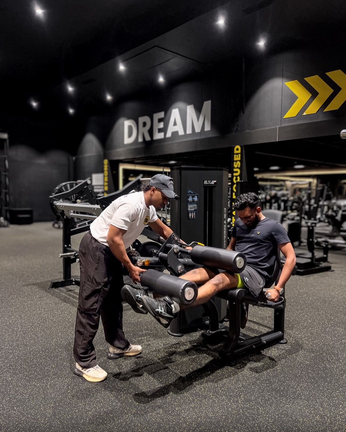 Member on chest press beneath the DREAM wall
